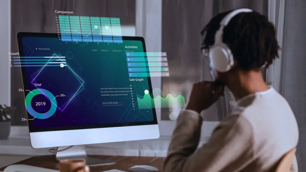 Gestora e equipe em escritório moderno analisando tela com gráficos de IA, simbolizando colaboração entre humanos e tecnologia