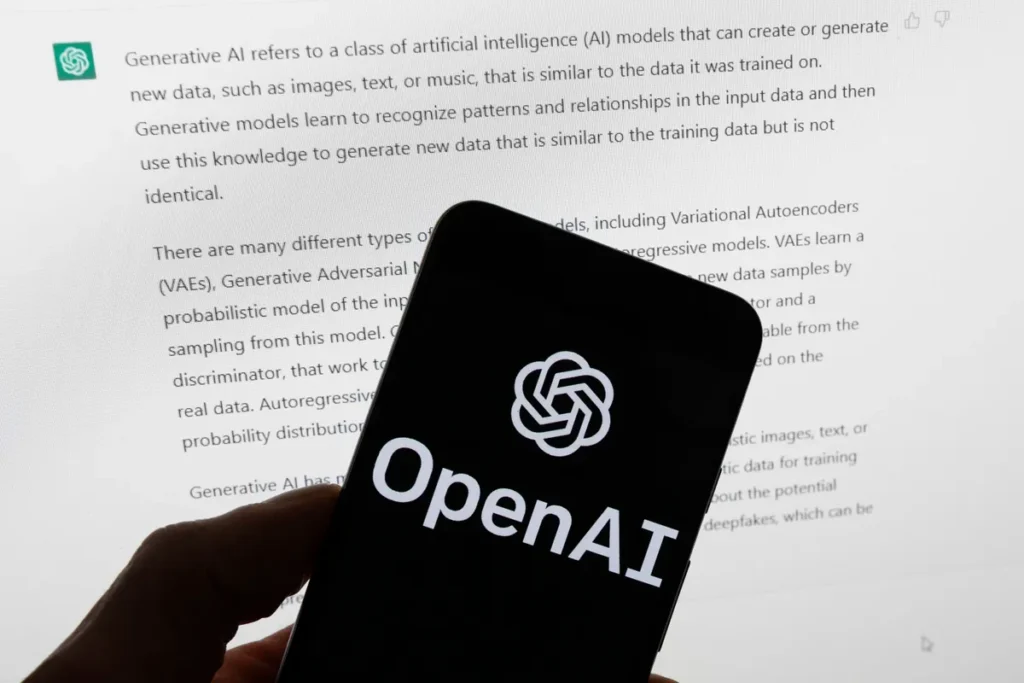 ChatGPT terá verificação de idade em meio a planos da OpenAI de liberar conteúdo adulto 1 Pessoa usando laptop e smartphone para verificação de idade no ChatGPT via Persona